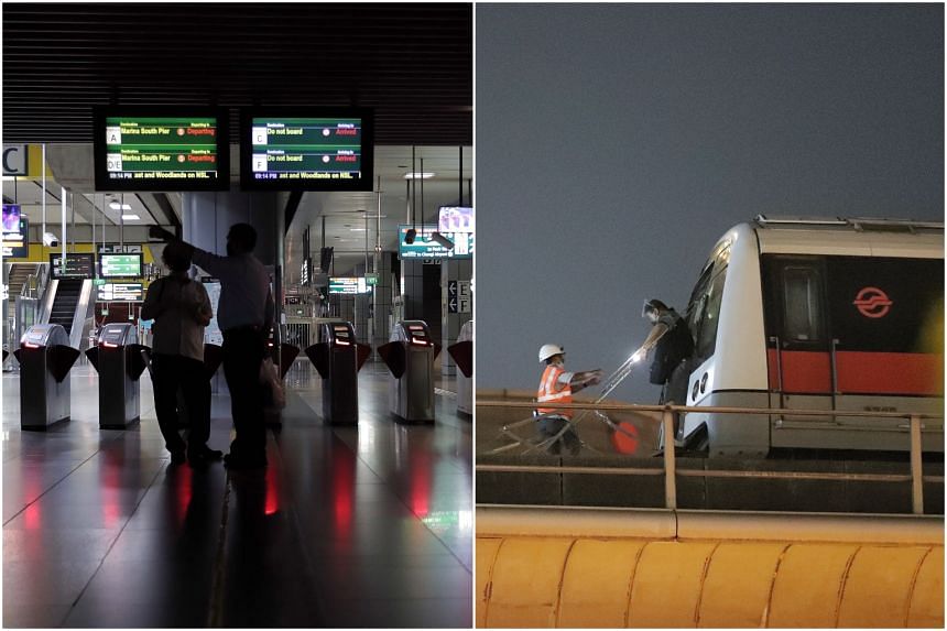 A power fault disrupted train services and caused a blackout at some MRT stations (left). Near Jurong East station (right), SMRT personnel had to help commuters down onto the tracks.