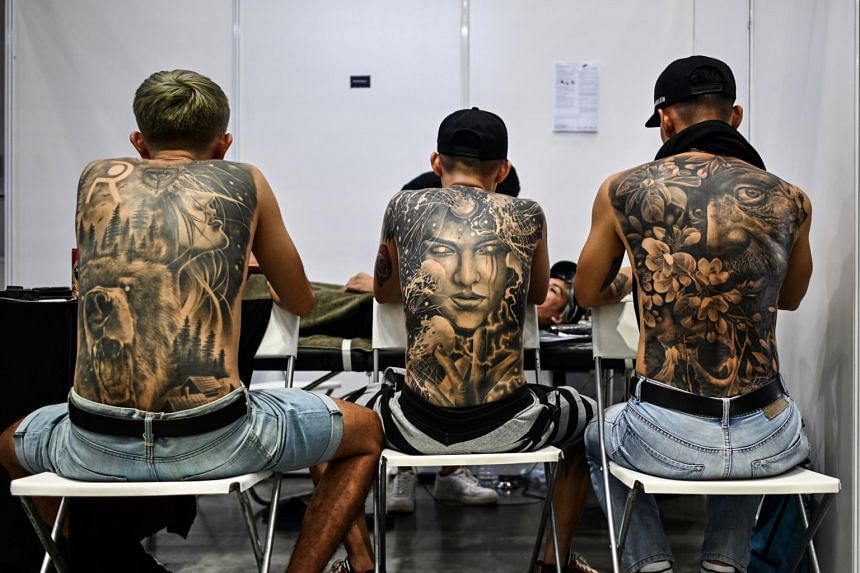 Tattoo expo organisers hauled up over half-naked models 