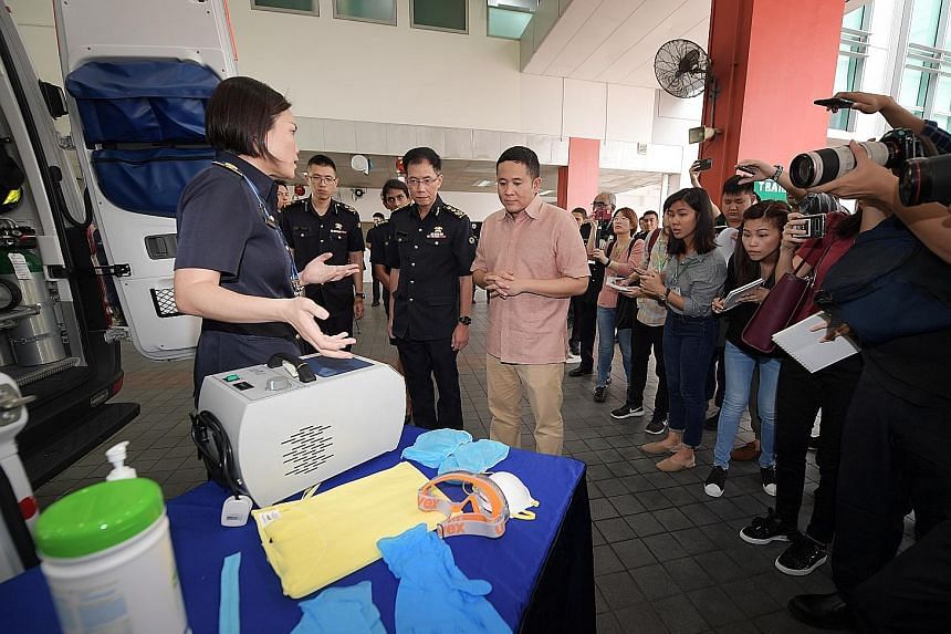 Lieutenant-Colonel Janice Oh, senior assistant director of Singapore Civil Defence Force's Emergency Medical Services Department, telling Senior Parliamentary Secretary for Health Amrin Amin the measures taken to disinfect ambulances that have ferrie