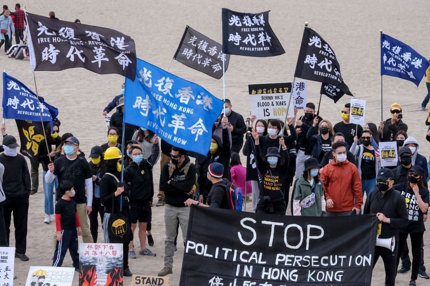 Hong Kongers participate in a flash mob march to show solidarity with Hong Kong pro-democracy activists in the US on March 7, 2021.