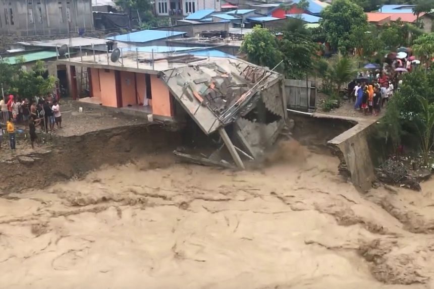 Floods and landslides kill dozens in Indonesia and East Timor