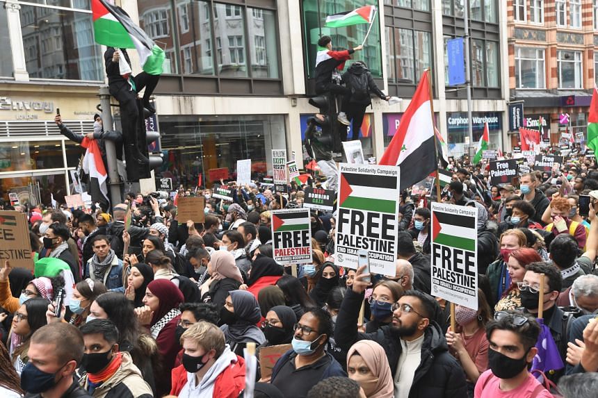 Supporters of Palestine attend a demonstration outside the Israeli embassy in London, on May 15, 2021.