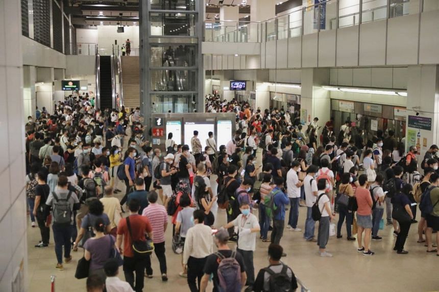 The crowd at Serangoon station at 7.43am, on May 21, 2021. An announcement is made that service has resumed but it is still congested due to the previous train delay. 