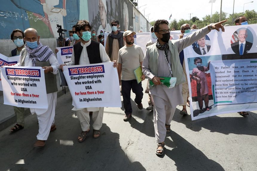 Former Afghan interpreters, who worked with US troops in Afghanistan, demonstrate in front of the US embassy in Kabul in June 2021.