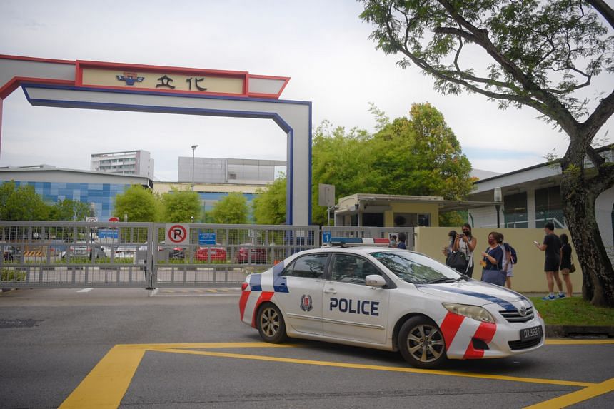 A police car exits River Valley High School on July 19, 2021.
