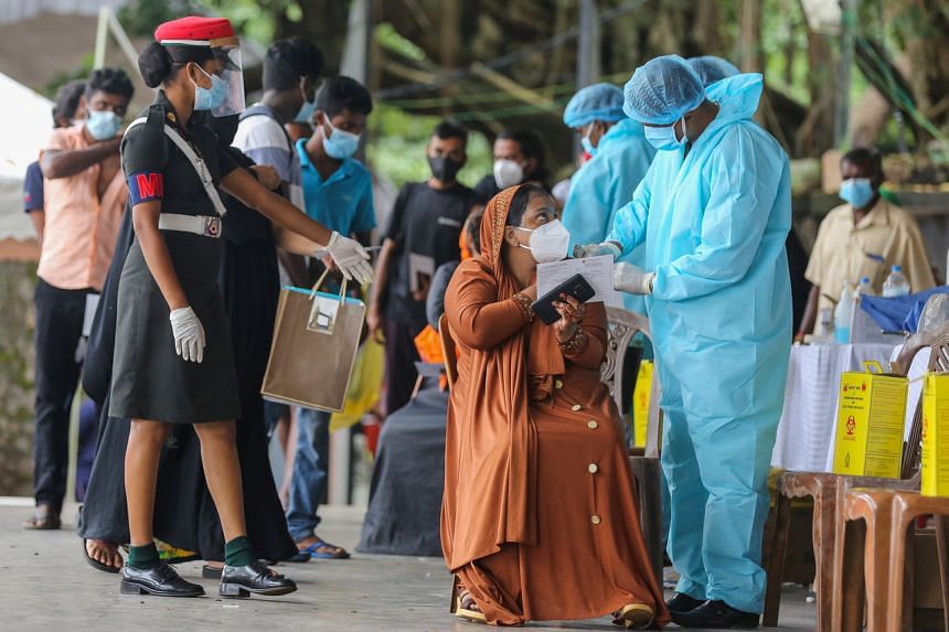 Sri Lanka Army health workers administer Covid-19 vaccine shots at a vaccination centre in Colombo, on Aug 10, 2021.