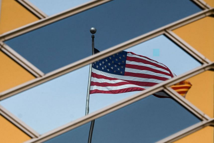The US flag is reflected on the windows of the US Embassy in Kabul.