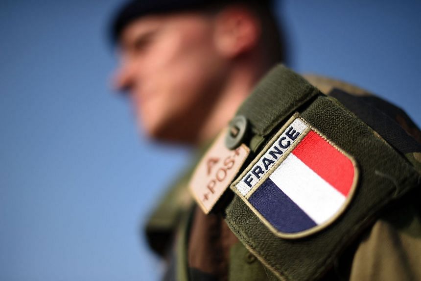 A 2014 photo shows a French soldier taking part in an end of Nato mission ceremony in Kabul.