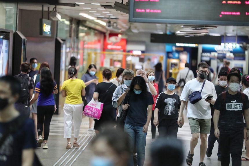 Commuters at Bugis MRT station on Aug 19, 2020. 