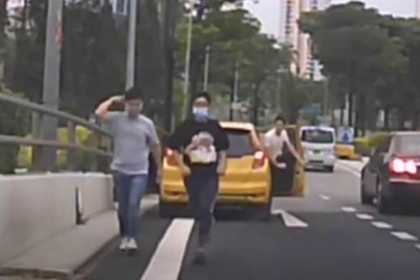 Four men in the yellow car are under investigation for allegedly harassing a male driver involved in the accident.