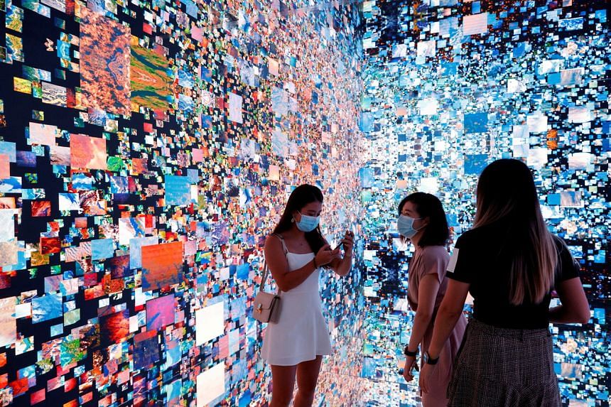 Visitors pictured in front of an immersive art installation in Hong Kong, on Sept 30, 2021.