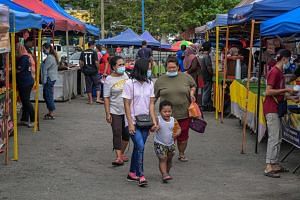 People visit a market in Pahang, Malaysia, on Jan 20, 2021.