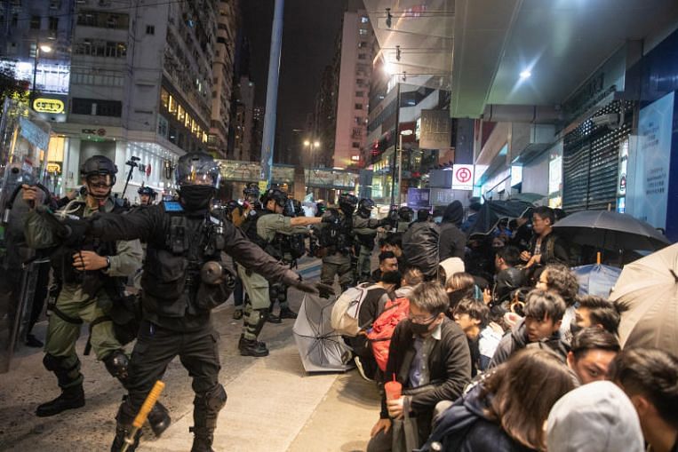 Hong Kong rings in New Year with tear gas, clashes ...
