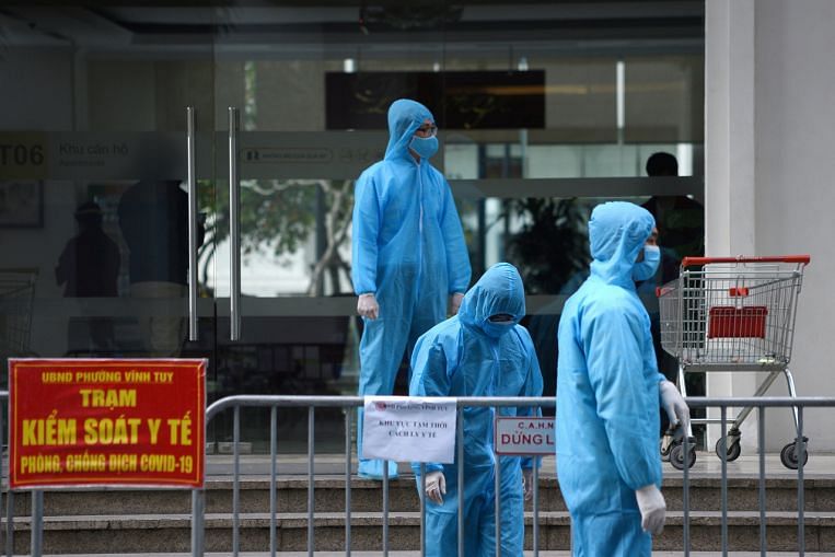 Vietnam reports record 9,690 Covid-19 infections